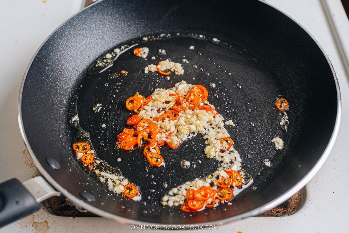 Cook aromatics and chili pepper