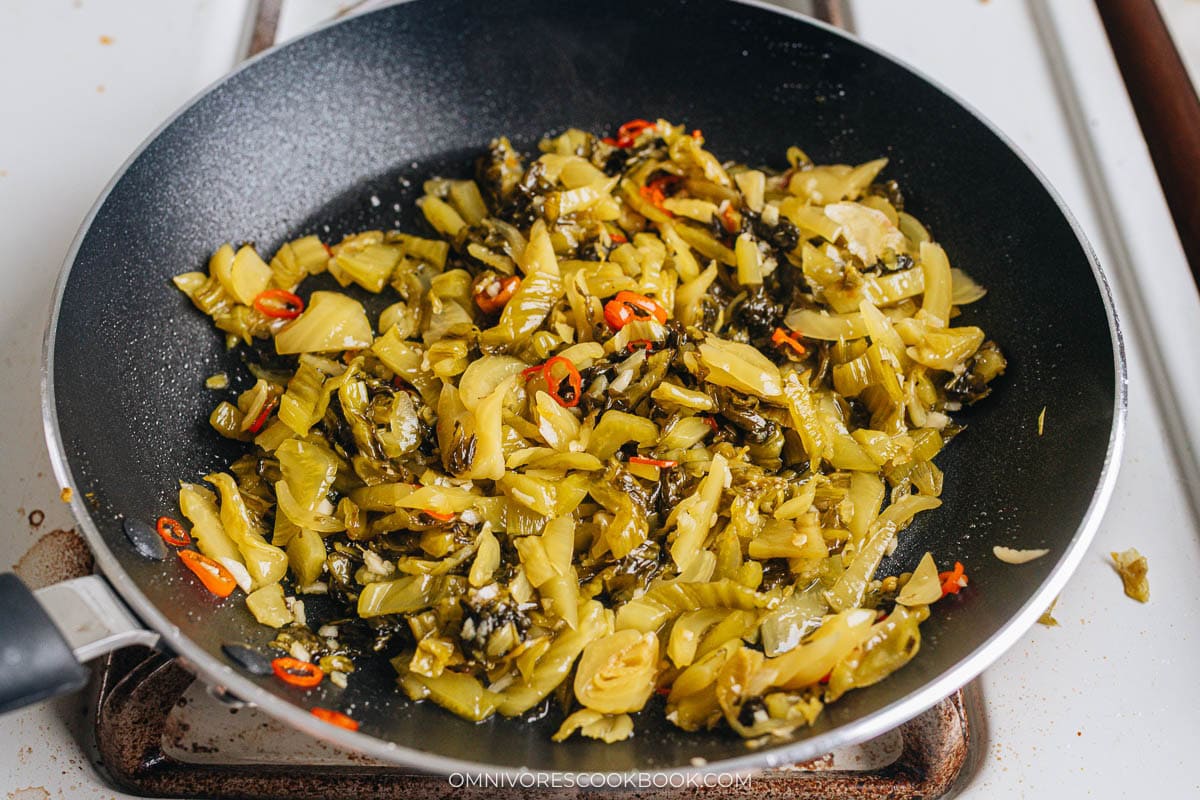 Cook the pickled mustard greens
