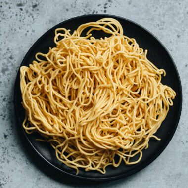 Uncooked chow mein noodles in a plate