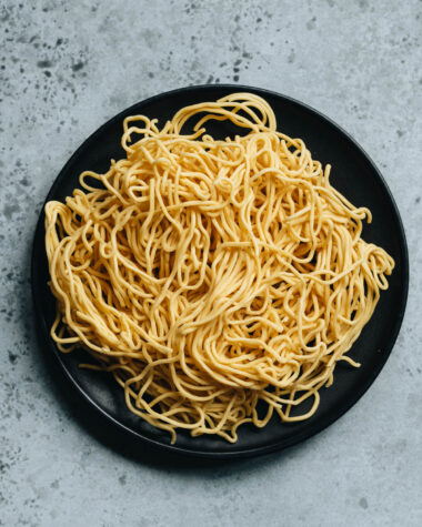 Uncooked chow mein noodles in a plate