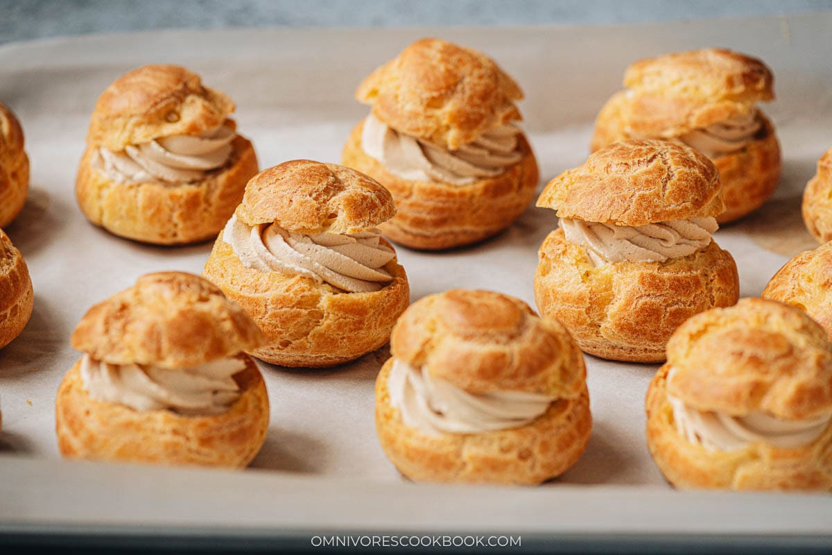 Homemade cream puffs on a baking sheet