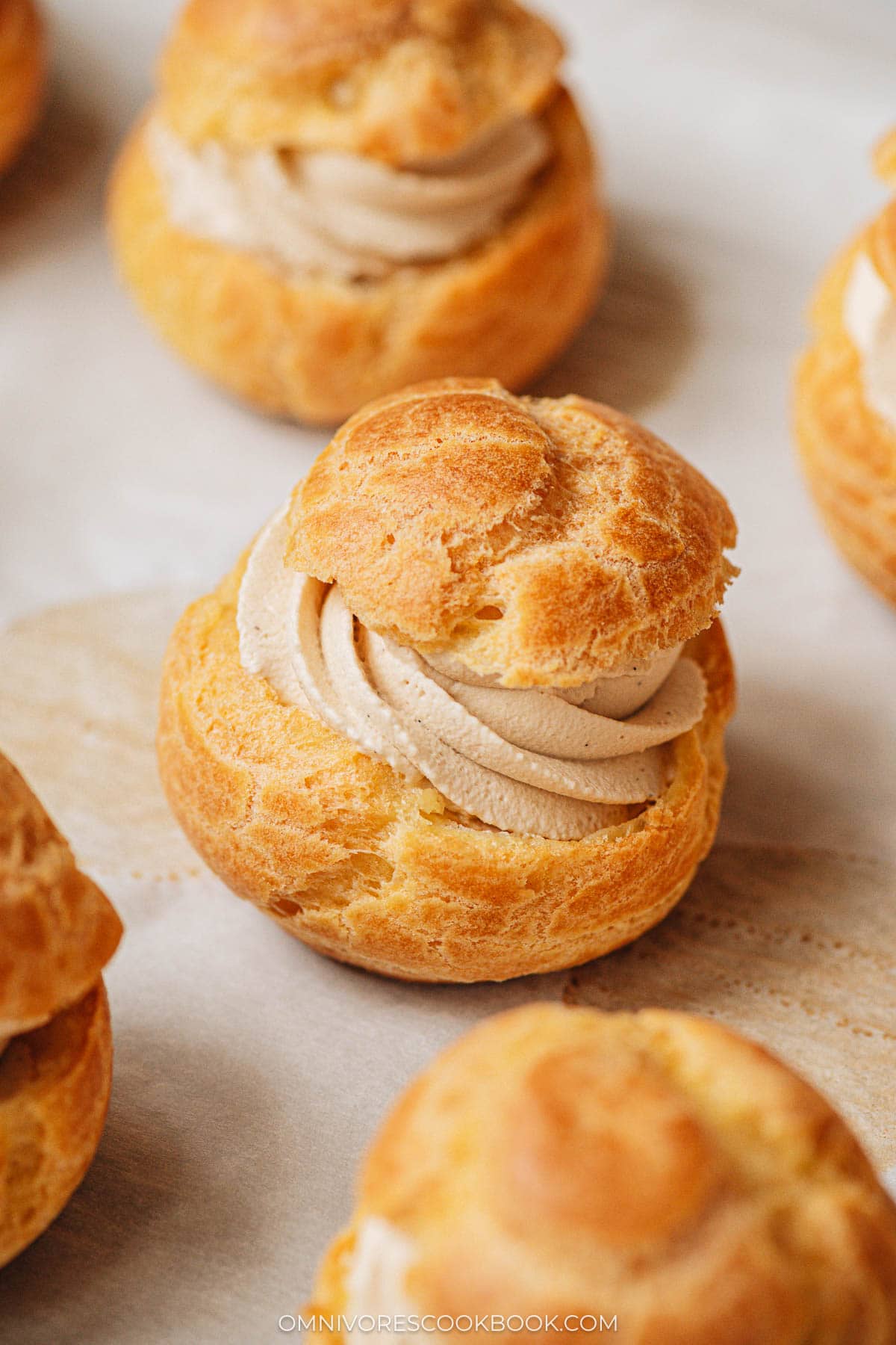 Cream puffs on a baking sheet close up