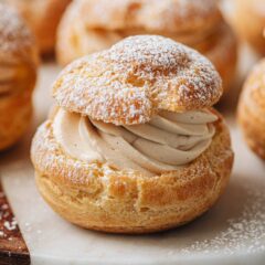 Light flaky choux pastry filled with a rich and creamy milk tea filling, these milk tea cream puffs are perfect for Mother’s Day, afternoon tea, or your Sunday dinner dessert.