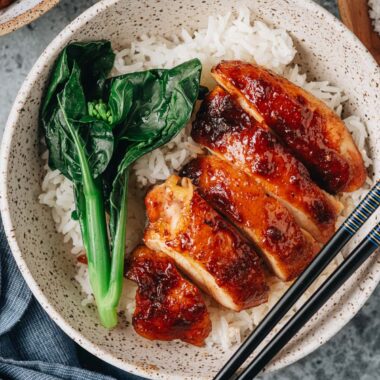 Homemade char siu chicken over rice with gai lan
