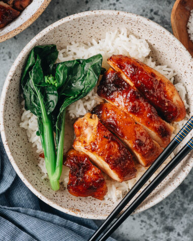 Homemade char siu chicken over rice with gai lan