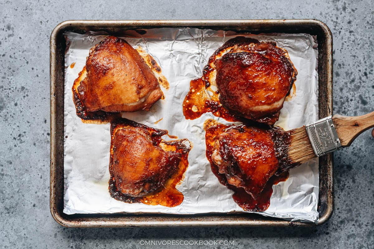 Glazing the chicken with char siu sauce