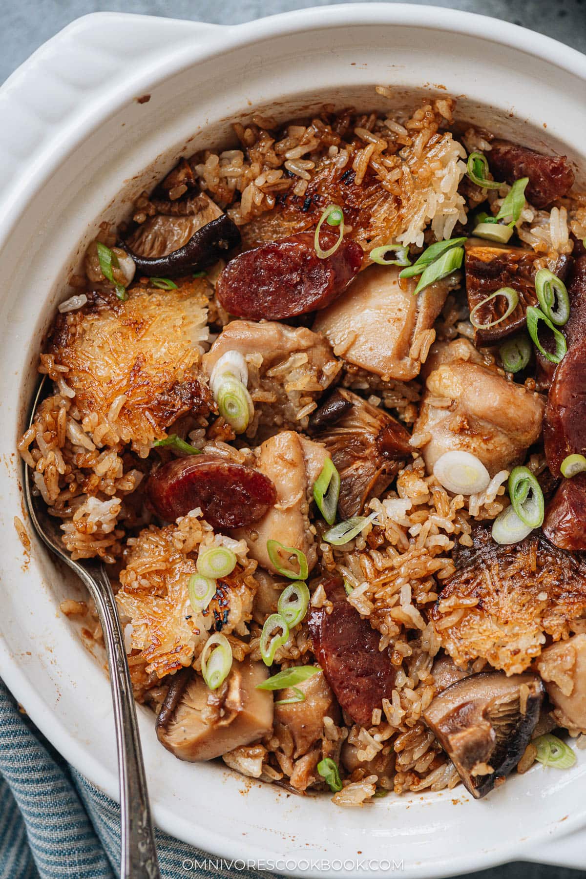 Homemade claypot rice with chicken, sausage and mushrooms