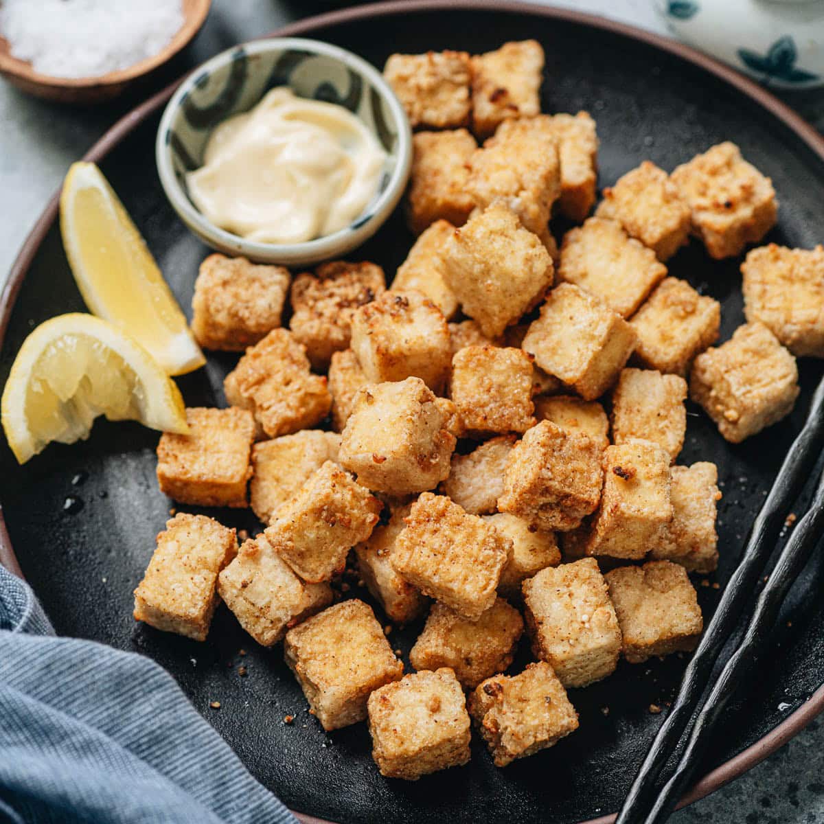 These air fryer tofu bites are extra crunchy and crispy, tossed with a delicious pepper salt spice mix. It’s a perfect snack or appetizer served by itself, or a great topping for your rice and salad bowls. {Vegetarian, Gluten-Free Adaptable}