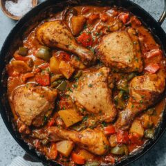African chicken features juicy chicken with crispy skin, tender potato, and colorful peppers elevated by a peanut butter and coconut based curry sauce. Sweet, savory, nutty, and spicy! And it all comes together in one pan, fuss-free. {Gluten-Free Adaptable}