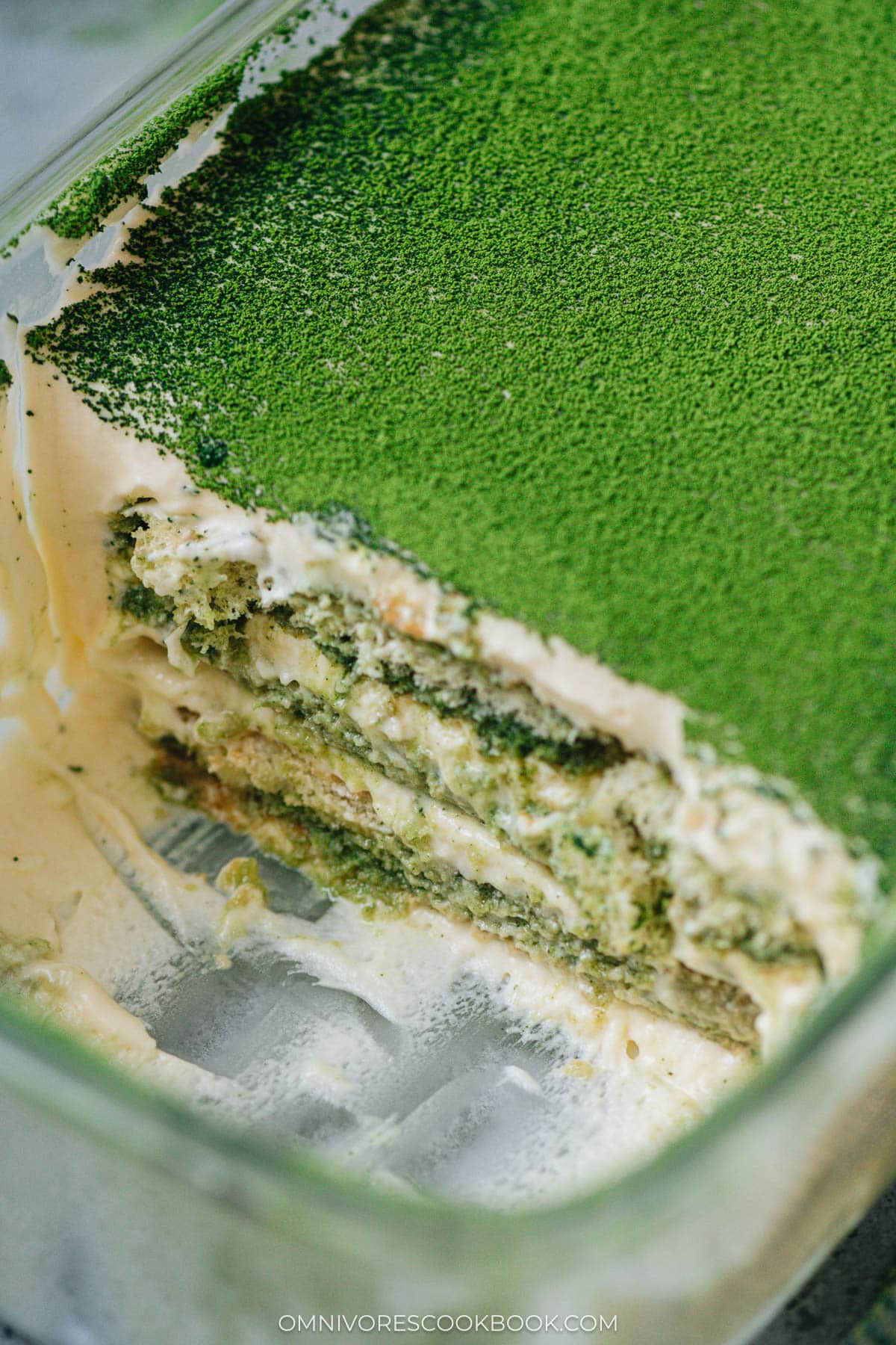 Sliced matcha tiramisu in a baking dish