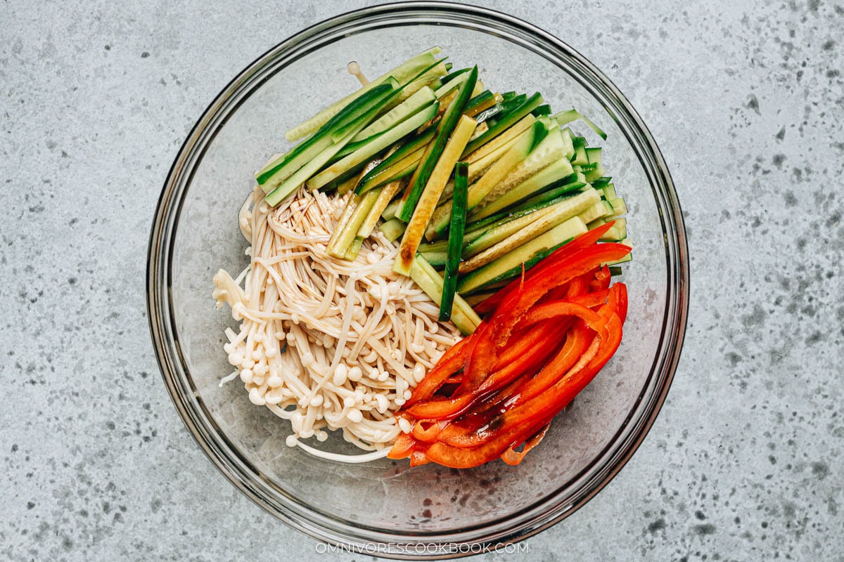 Mixing the enoki mushroom salad