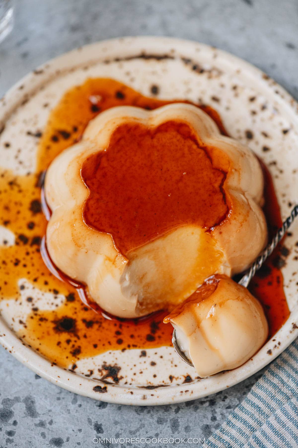 Hojicha purin close up with a spoonful to show texture