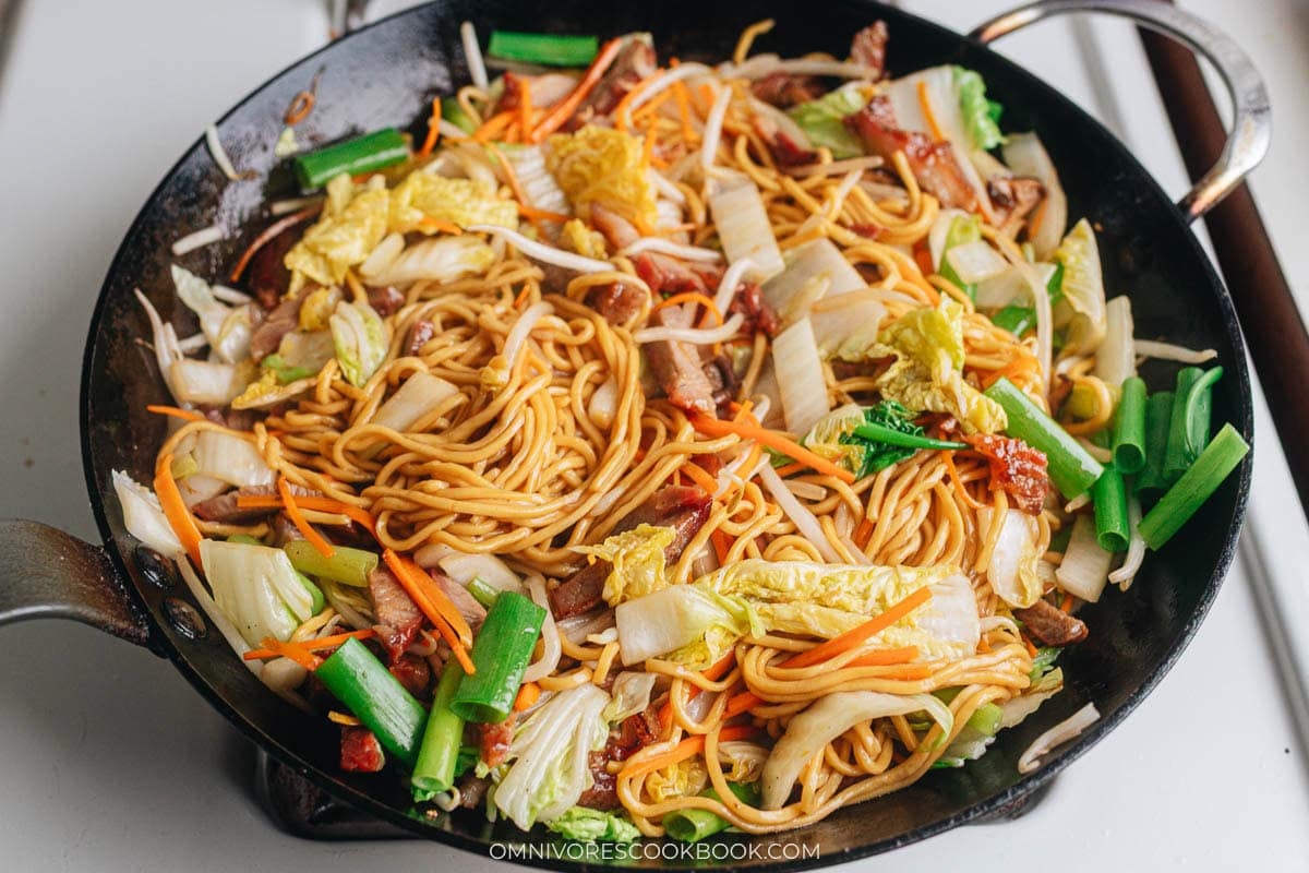 Toss roast pork lo mein in a pan