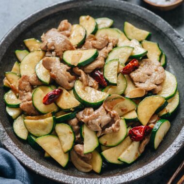 Chinese zucchini and pork stir fry served in a plate