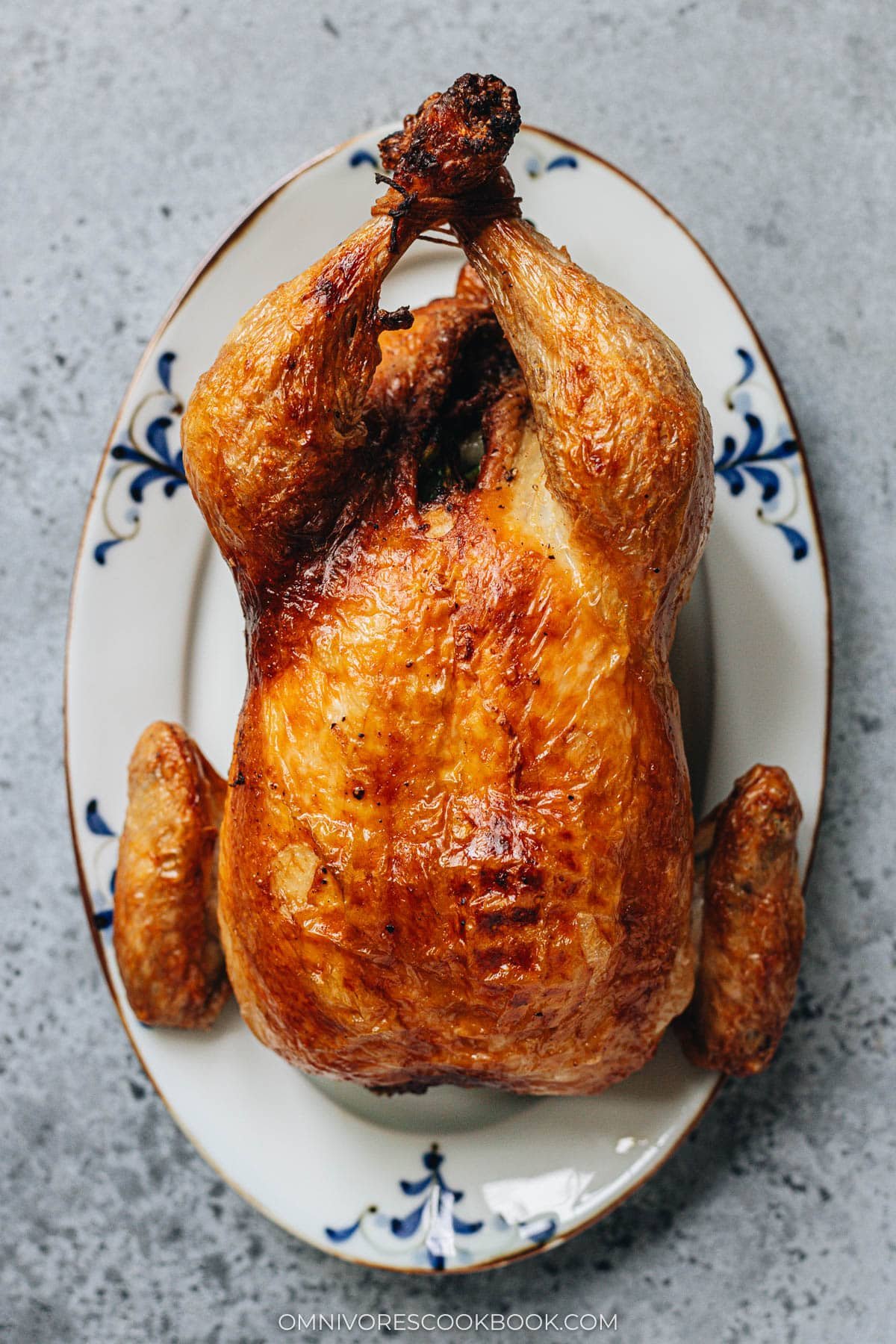 Air fryer Chinese roast whole chicken served on a plate
