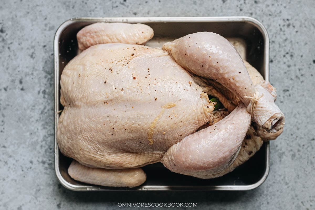 Tied up and seasoned whole chicken