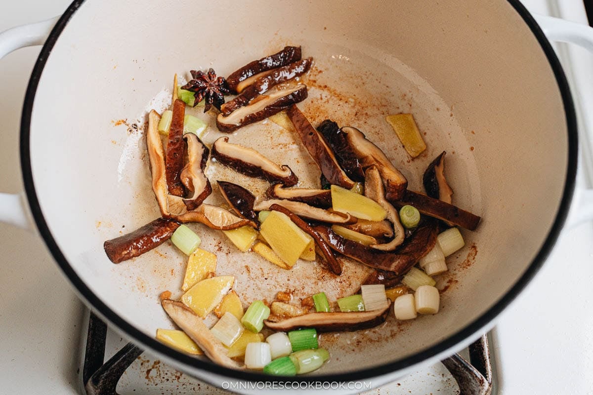 Saute the aromatics and shiitake mushrooms