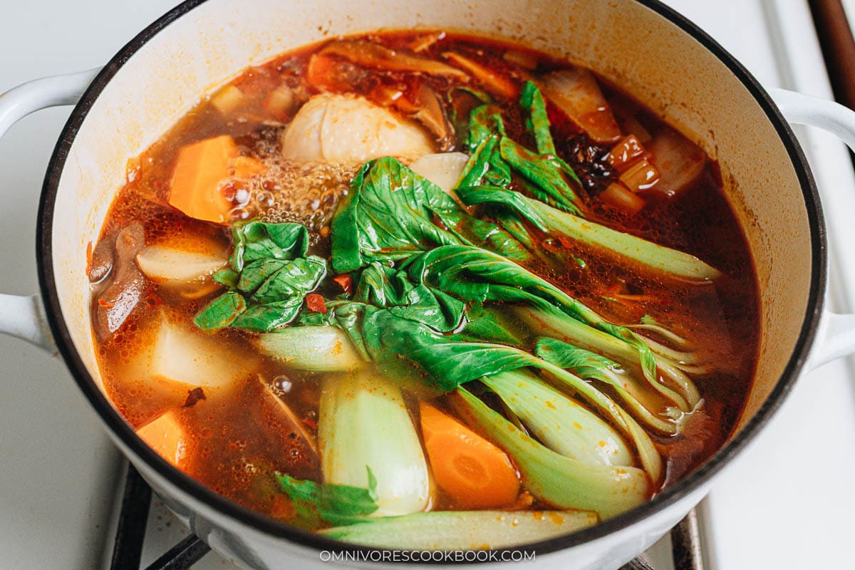 Finish up the braising by adding baby bok choy