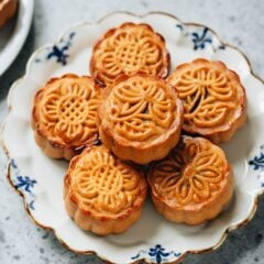 My homemade traditional mooncake uses a creamy nutty black sesame filling paired with salted duck egg yolk, creating a rich yet not-to-sweet pastry that is much more fragrant than the store bought ones. I’ve included detailed step-by-step pictures along with a video, showing you how to make this delicate Chinese pastry in your own kitchen.