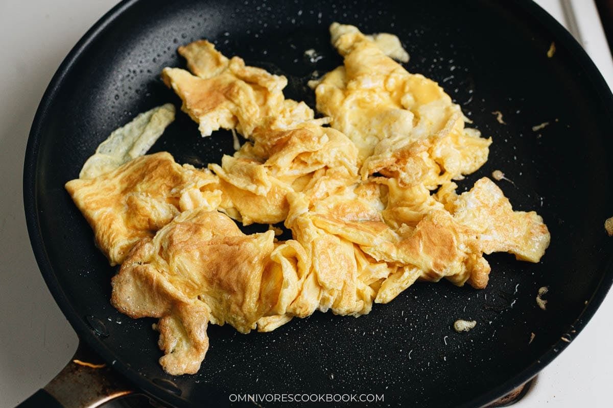 Scramble eggs in a skillet 