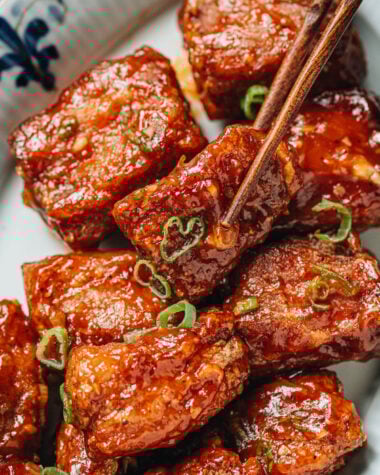 Using chopsticks to pick up a Peking pork rib