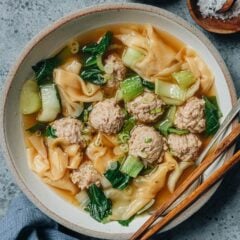 Deconstructed wonton soup is one of my favorite weeknight dinners when I am craving comfort food but short on time. The juicy bite-size pork meatballs are cooked in chicken soup with silky wonton wrappers and tender bok choy, making a balanced and nutritious meal.