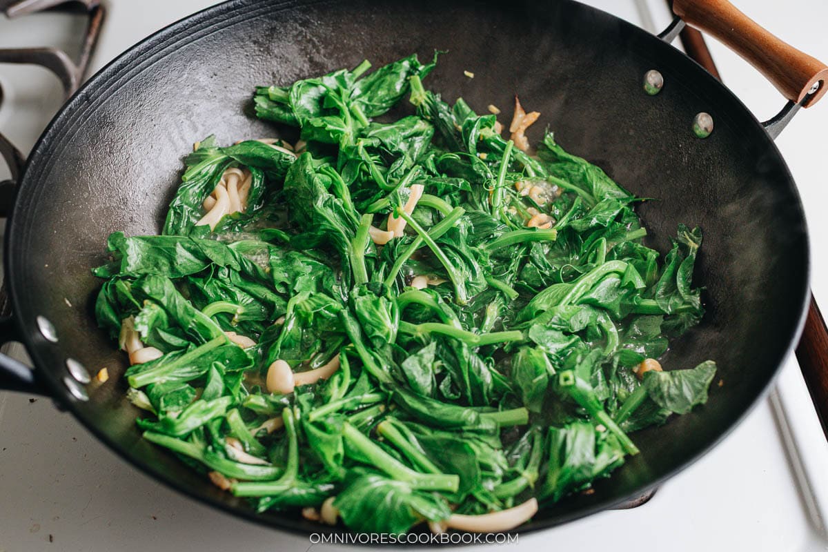 Braising pea shoots in the broth
