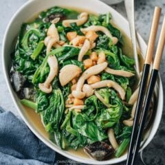 Chinese braised pea shoots is one of my favorite side dishes. Snow pea shoots and shimeji mushrooms are simmered in chicken stock infused with ginger, garlic, dried seafood and century egg, creating a vibrant vegetable dish that is full of texture and flavor. It is very easy to put together and allows you to enjoy a large amount of vegetables.