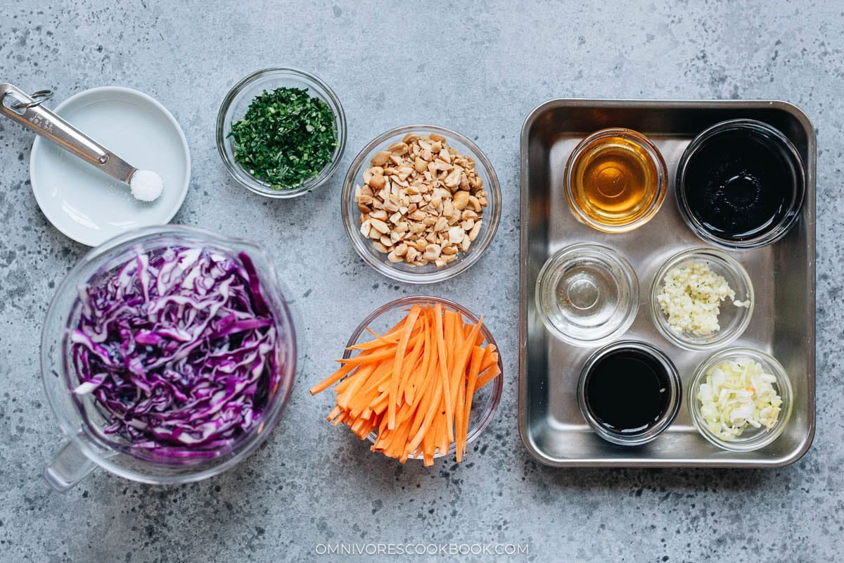 Ingredients for Chinese coleslaw include cabbage, carrots, peanuts, cilantro, and dressing.