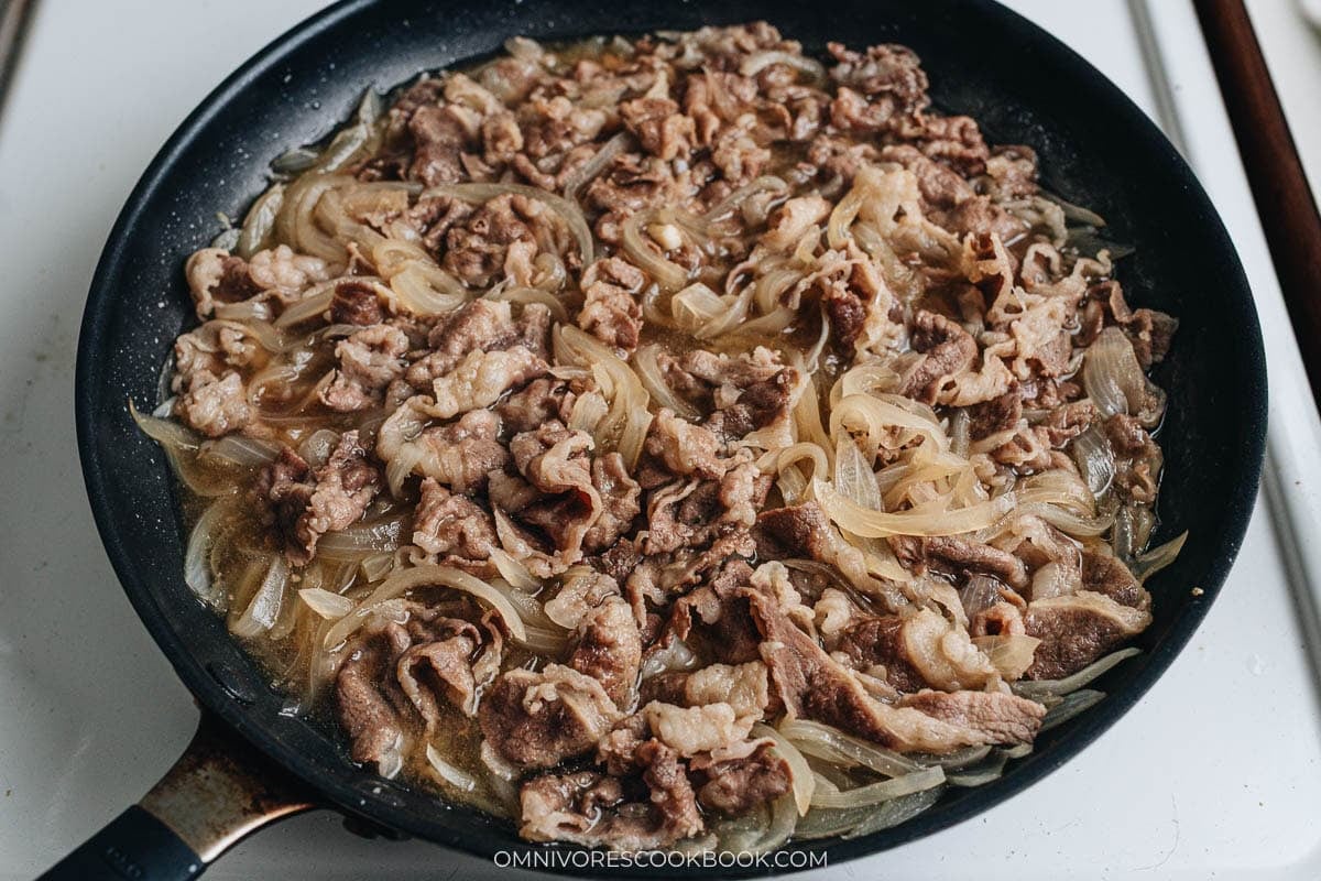 Thinly sliced beef and onions simmered together in a skillet, coated in a savory-sweet soy sauce broth.