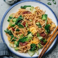 My easy fried noodles make a quick, comforting meal with chewy noodles, crisp bok choy, savory Chinese sausage, and soft scrambled eggs. Everything comes together in under 20 minutes for a satisfying dish that’s simple yet full of flavor.