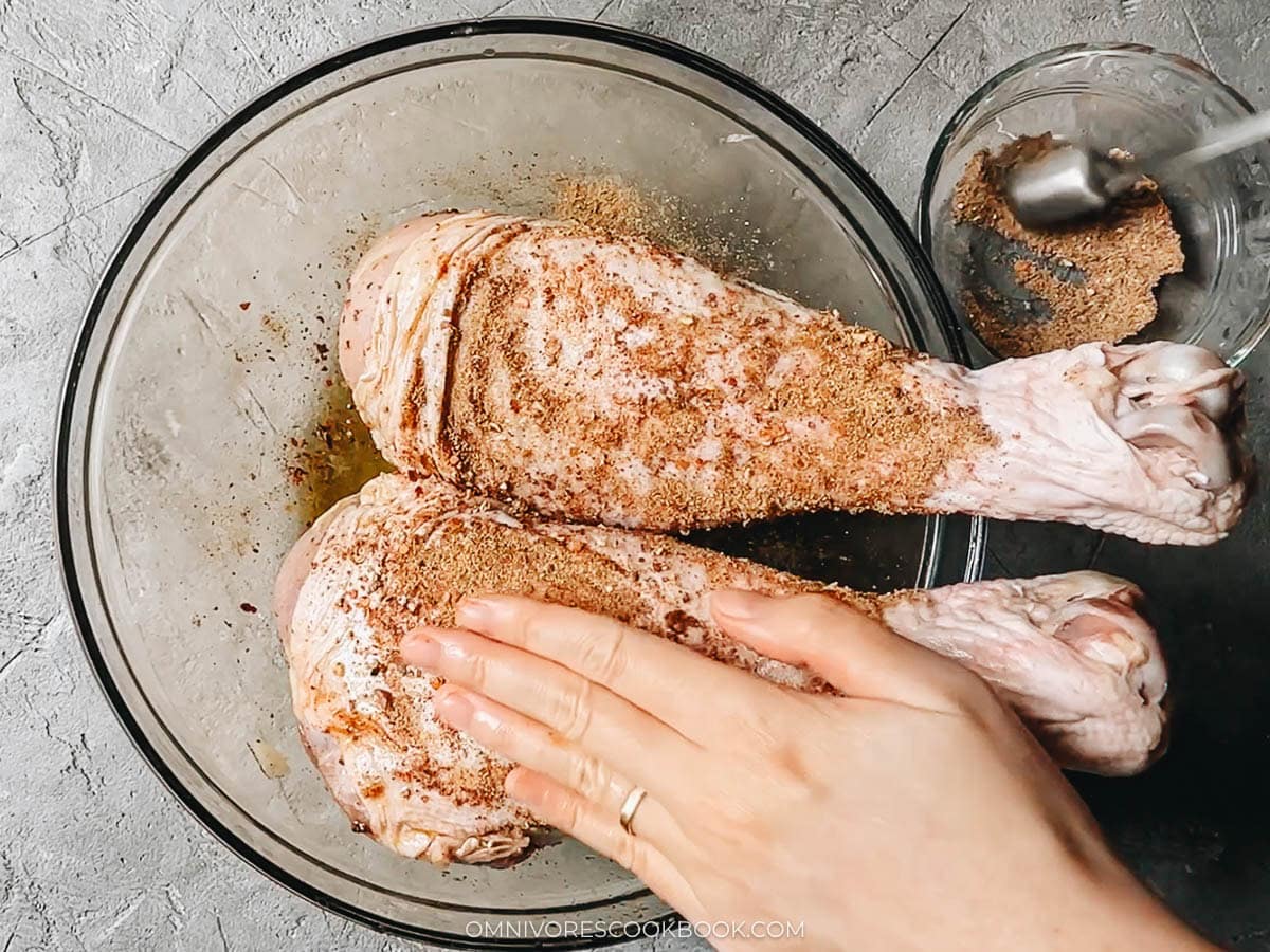 Rub the turkey legs with spice mix, salt, and oil