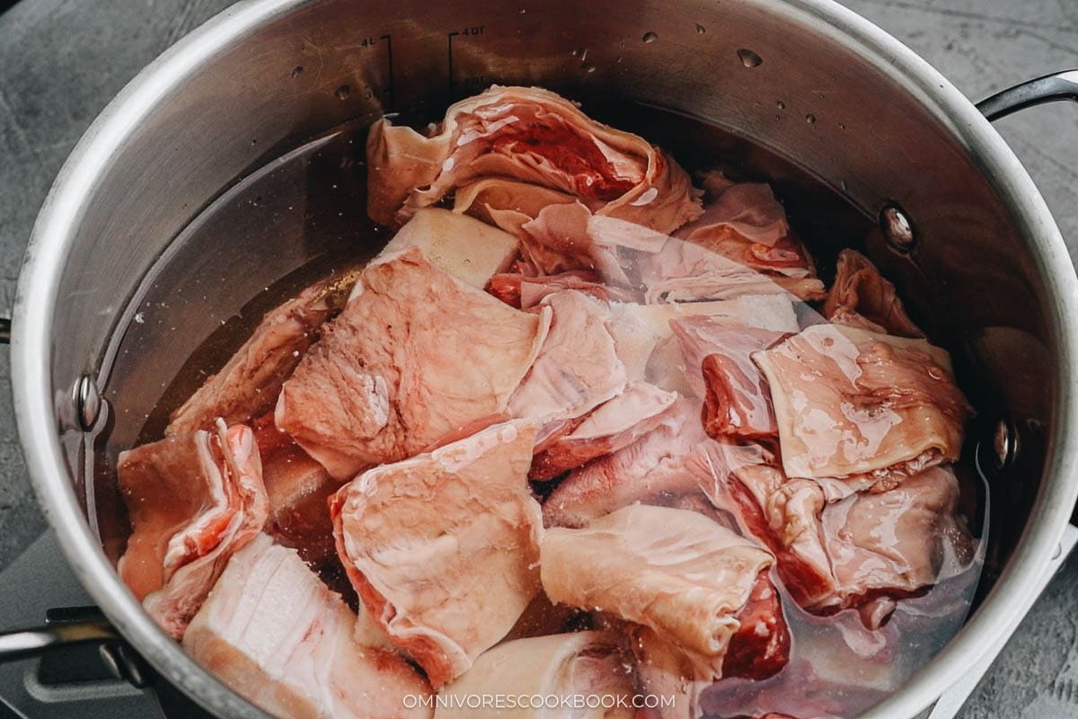 beef bones and meat in a large pot 