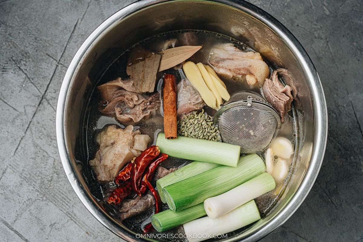 beef, bone, broth, spices and aromatics in a instant pot 