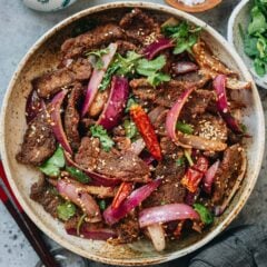 My cumin beef recipe uses a dry-stir-frying method to create extra crispy beef without deep frying, coated with bold seasonings that deliver true restaurant taste.