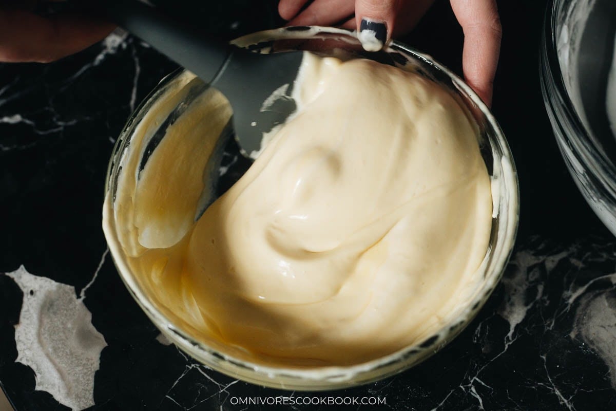 folding egg white mixture into the egg yolk mixture