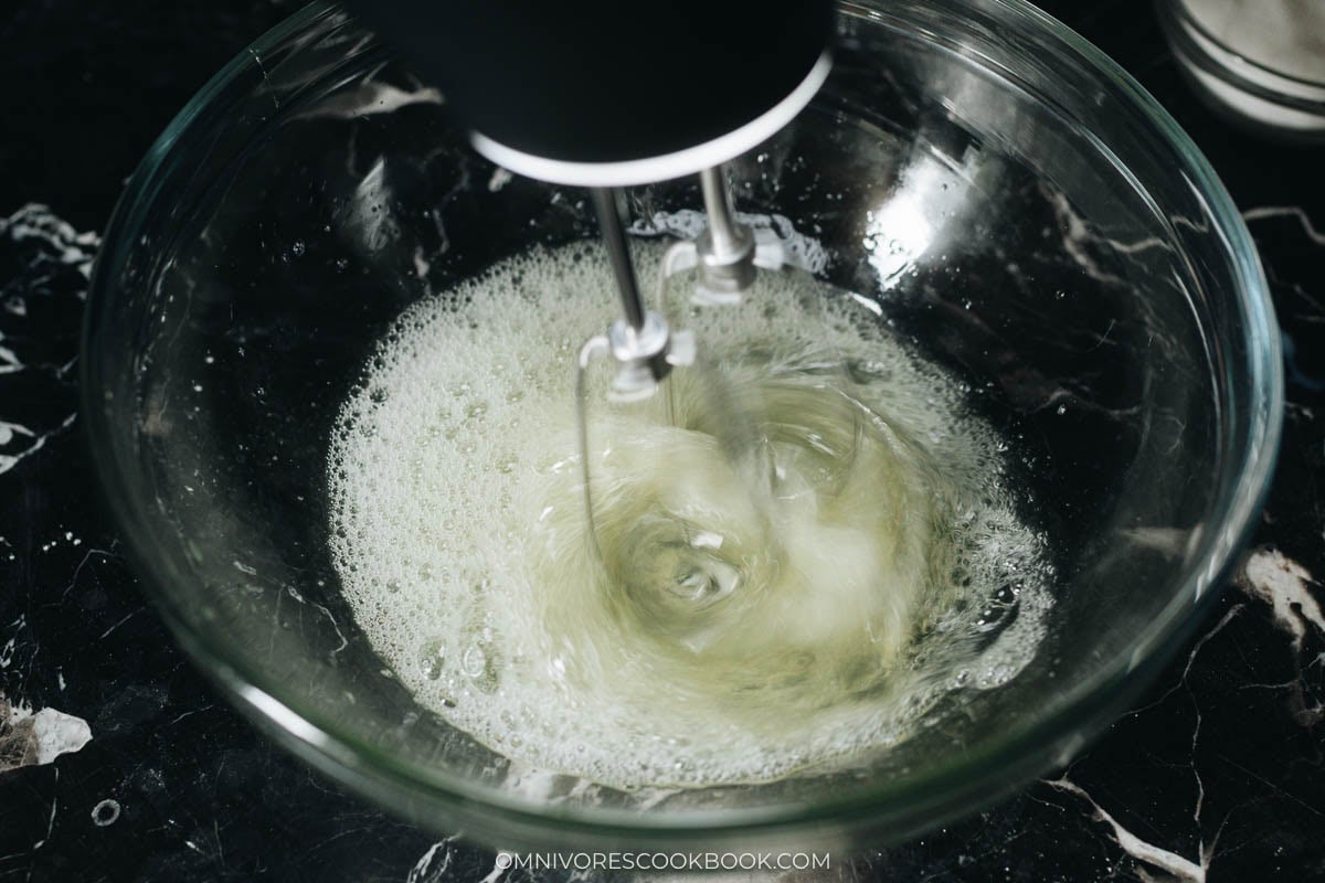 Beat the egg whites with lemon juice