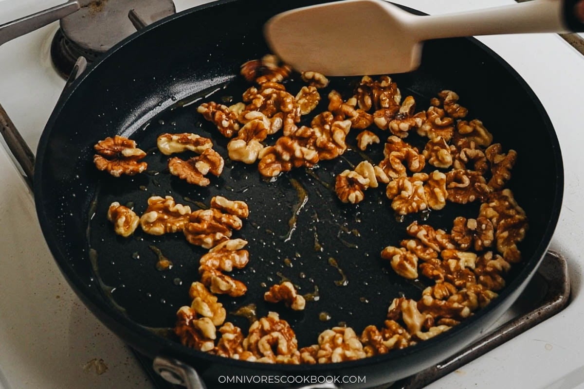 walnuts and stir to coat