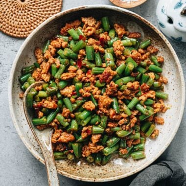 Stir-fried green beans with ground pork served in a bowl