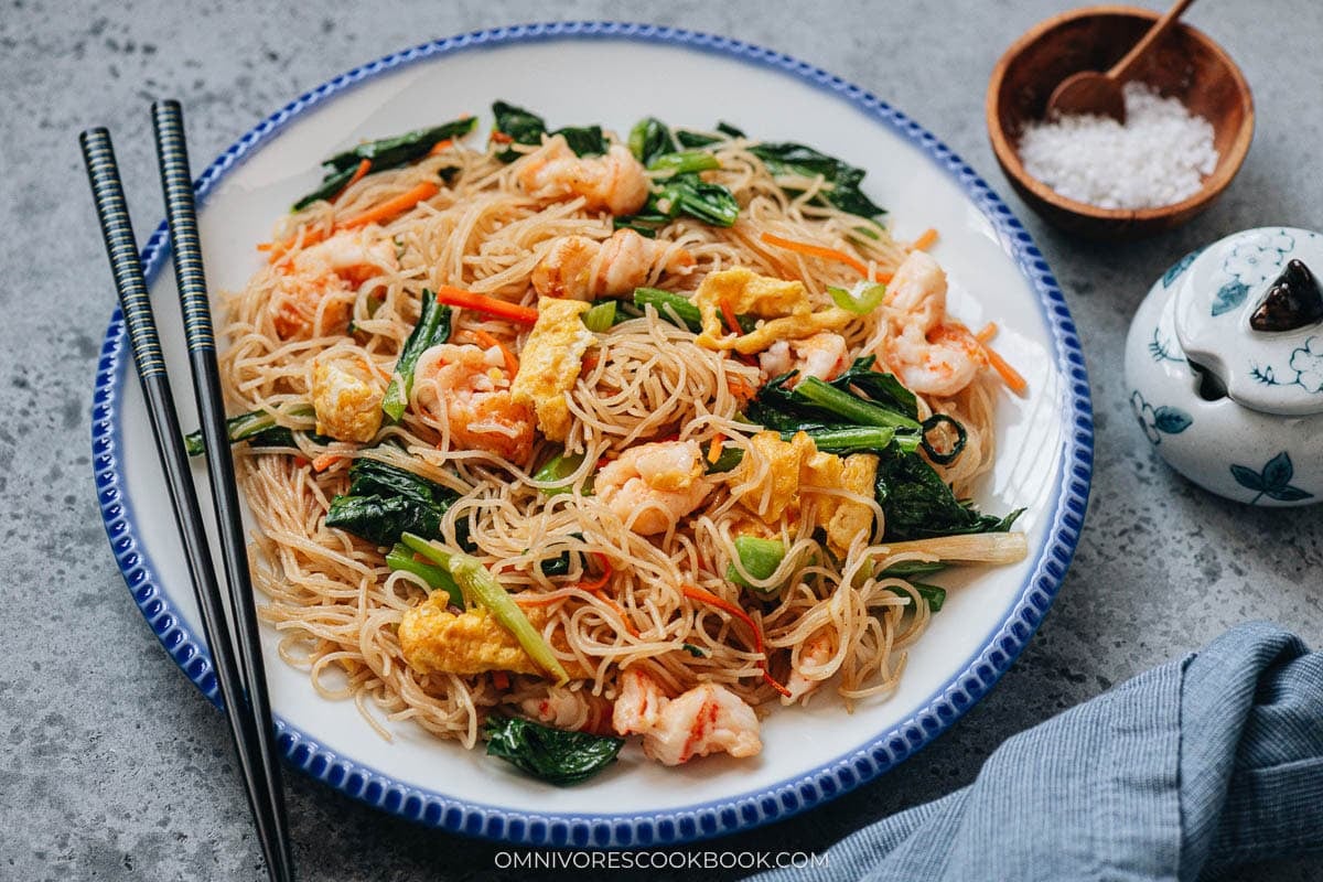 Shrimp mei fun served on a large plate with chopsticks on the side.