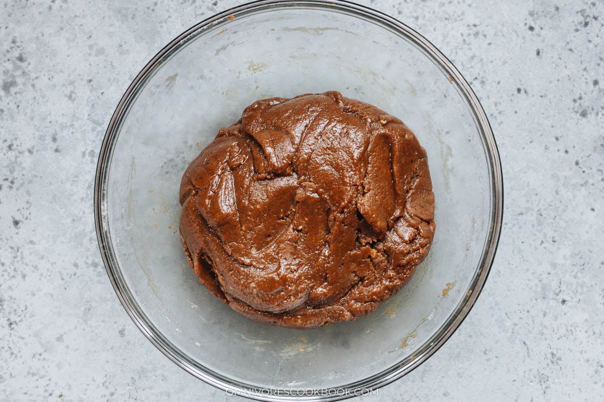 Cookie dough resting in a mixing bowl