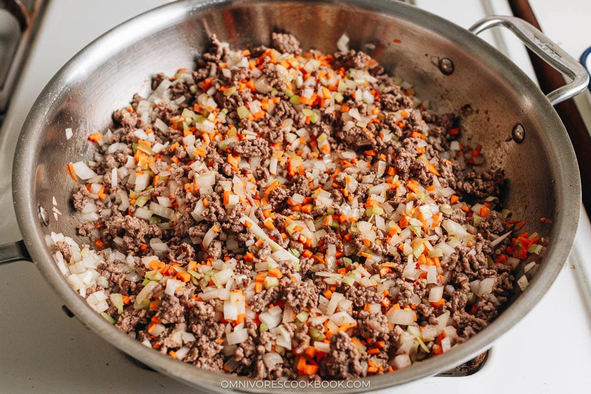 cooking onion, carrot, celery, and garlic along with the beef