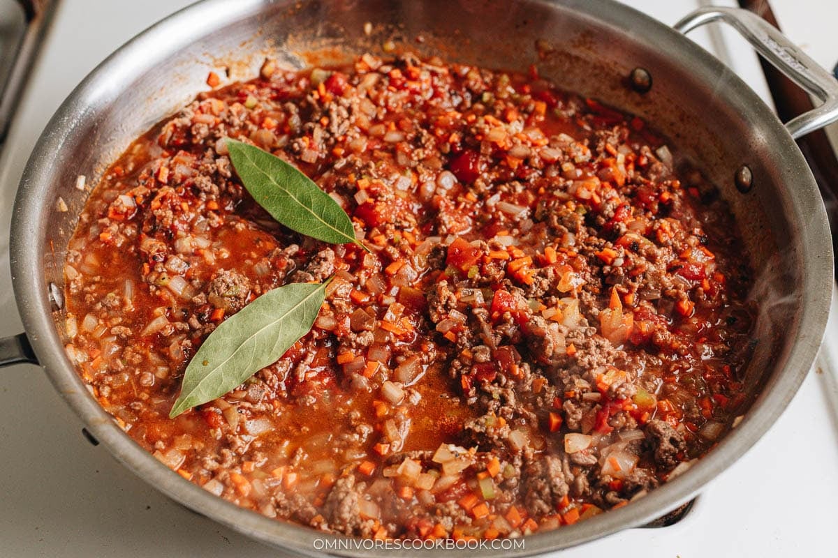 cooking bolognese sauce in a skillet