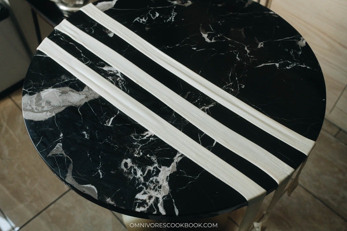 Pulled raw noodles on the table