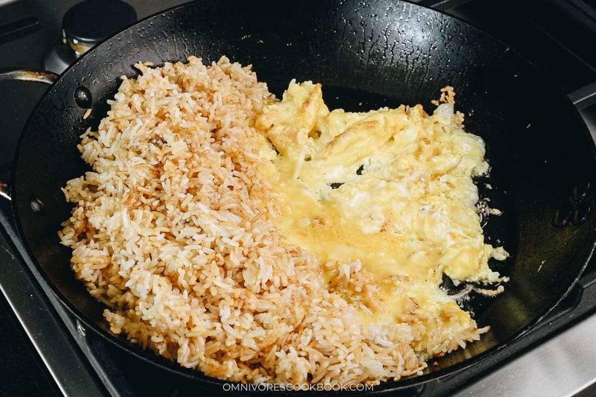 Scramble the eggs and mix them into the rice