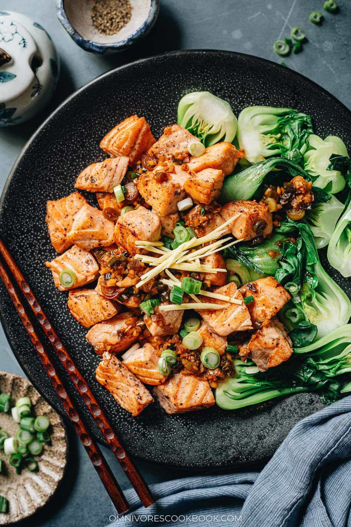 Pan fried salmon served with baby bok choy close up