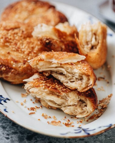 Cross section of guo kui showing flaky layers and savory pork filling