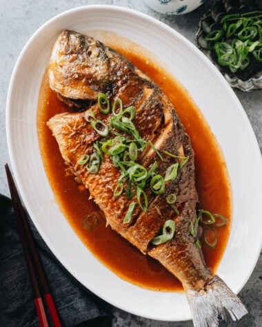 Chinese braised whole fish in soy sauce with scallions