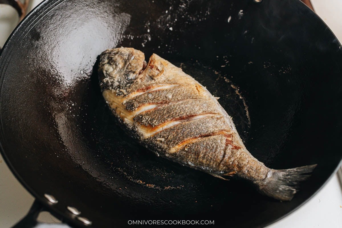 Whole fish pan fried in a wok until golden brown