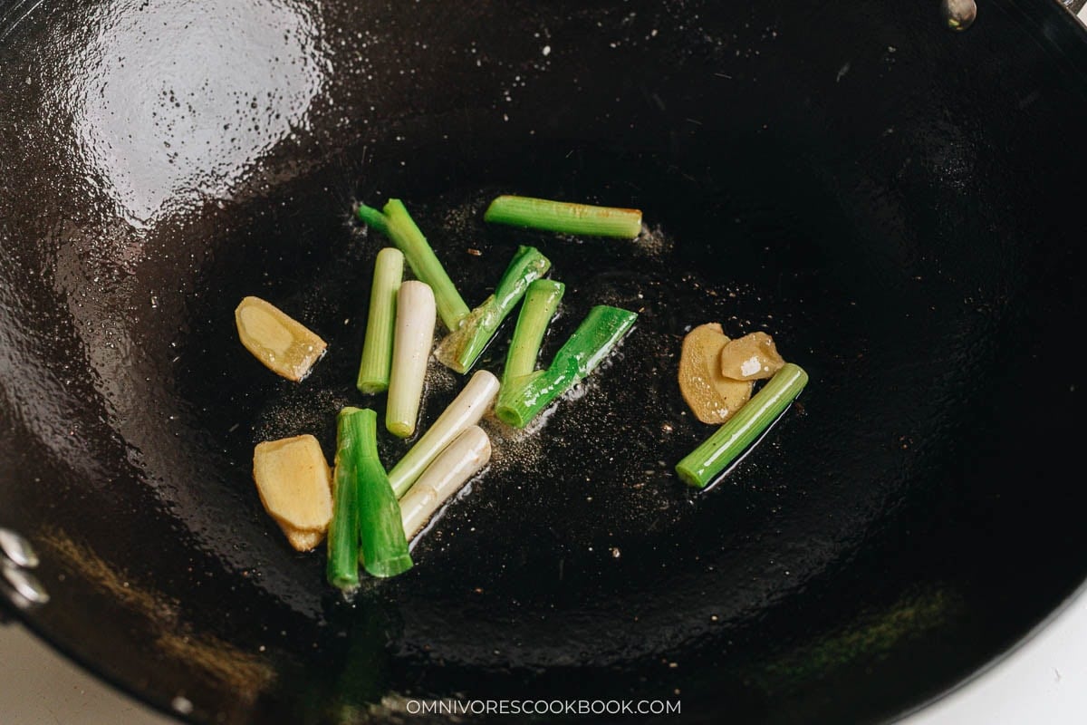 Ginger and scallions saut&eacute;ed in wok